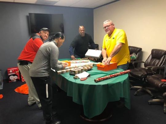 CCCoM wrapping Gifts for our Adopted Families