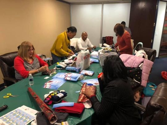 CCCoM wrapping Gifts for our Adopted Families