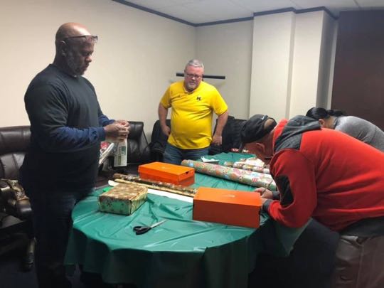 CCCoM wrapping Gifts for our Adopted Families