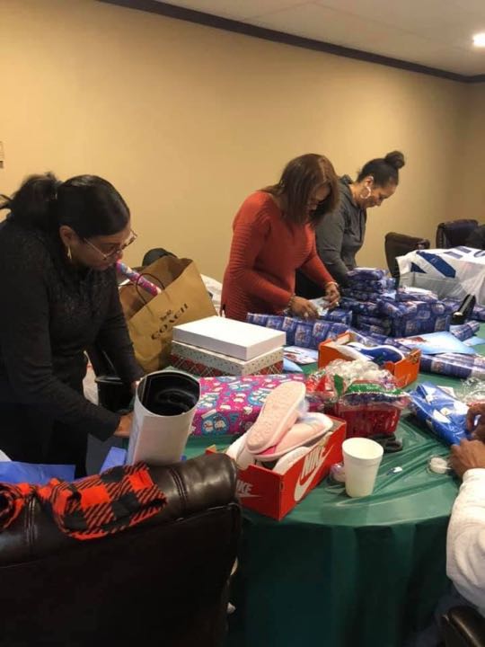 CCCoM wrapping Gifts for our Adopted Families