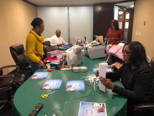 CCCoM wrapping Gifts for our Adopted Families