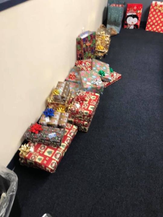 CCCoM wrapping Gifts for our Adopted Families