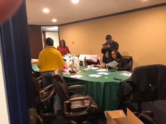 CCCoM wrapping Gifts for our Adopted Families