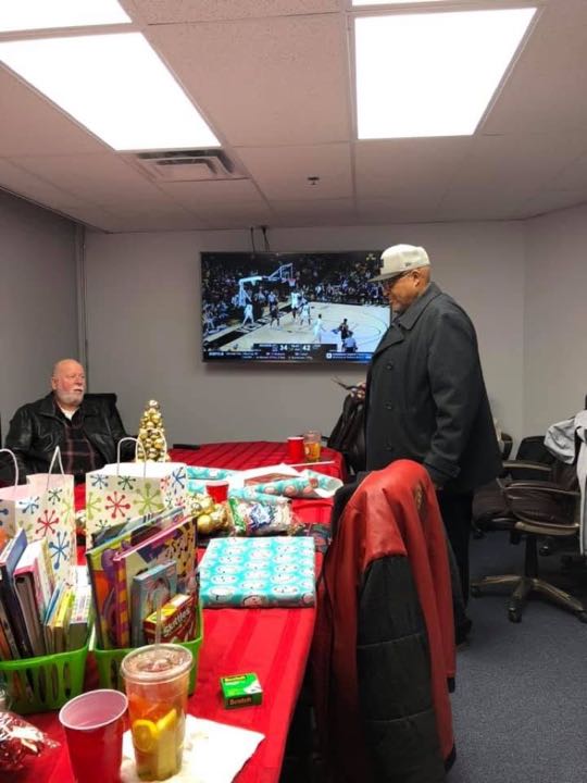 CCCoM wrapping gifts for our Adopted Families "Merry Christmas"
