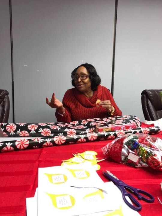 CCCoM wrapping gifts for our Adopted Families "Merry Christmas"