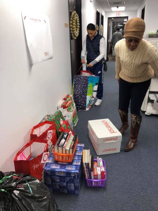 CCCoM wrapping gifts for our Adopted Families "Merry Christmas"