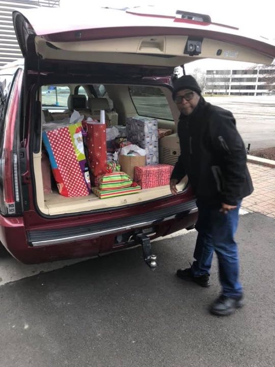 CCCoM wrapping gifts for our Adopted Families "Merry Christmas"