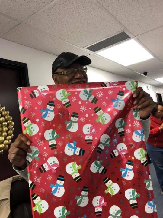 CCCoM wrapping gifts for our Adopted Families "Merry Christmas"