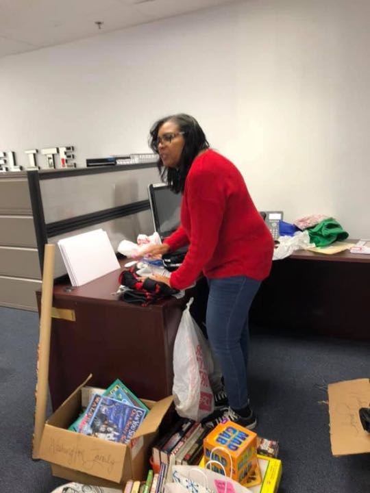CCCoM wrapping gifts for our Adopted Families "Merry Christmas"