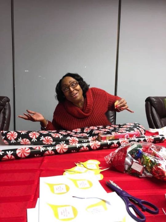 CCCoM wrapping gifts for our Adopted Families "Merry Christmas"