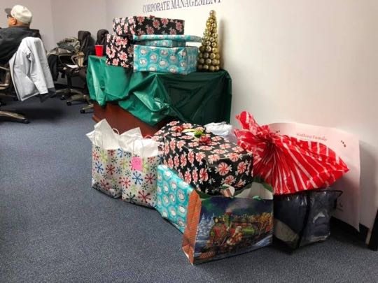 CCCoM wrapping gifts for our Adopted Families "Merry Christmas"