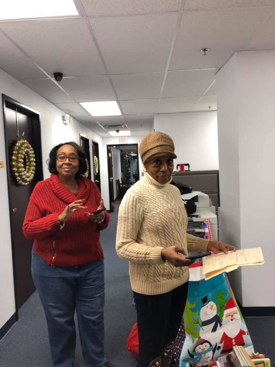 CCCoM wrapping gifts for our Adopted Families "Merry Christmas"