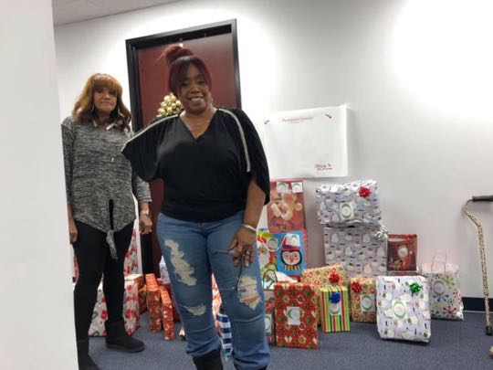 CCCoM wrapping gifts for our Adopted Families "Merry Christmas"