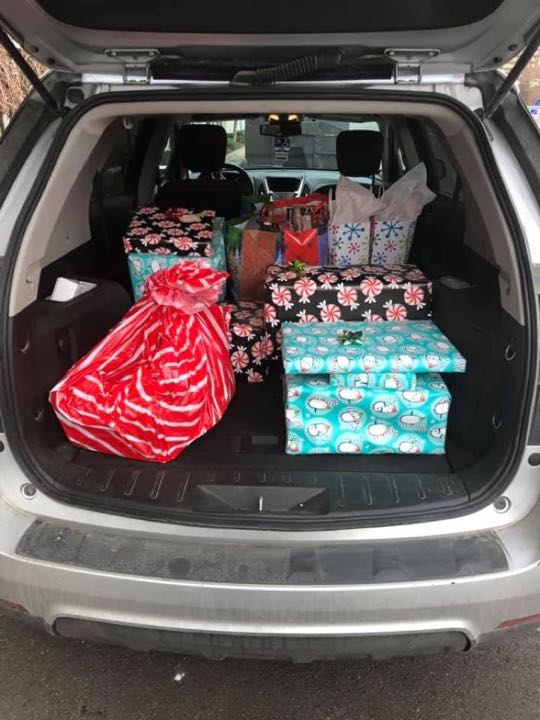 CCCoM wrapping gifts for our Adopted Families "Merry Christmas"