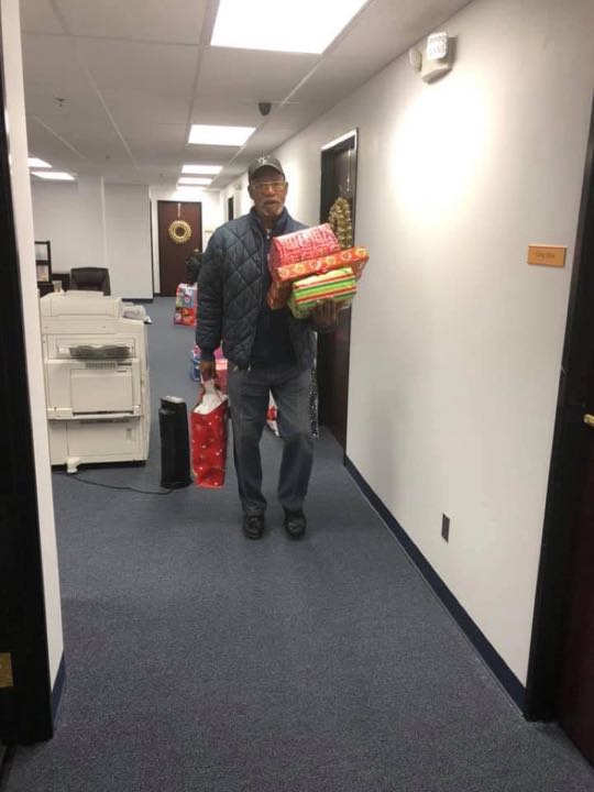 CCCoM wrapping gifts for our Adopted Families "Merry Christmas"