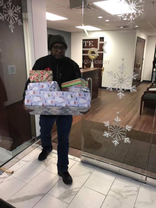 CCCoM wrapping gifts for our Adopted Families "Merry Christmas"